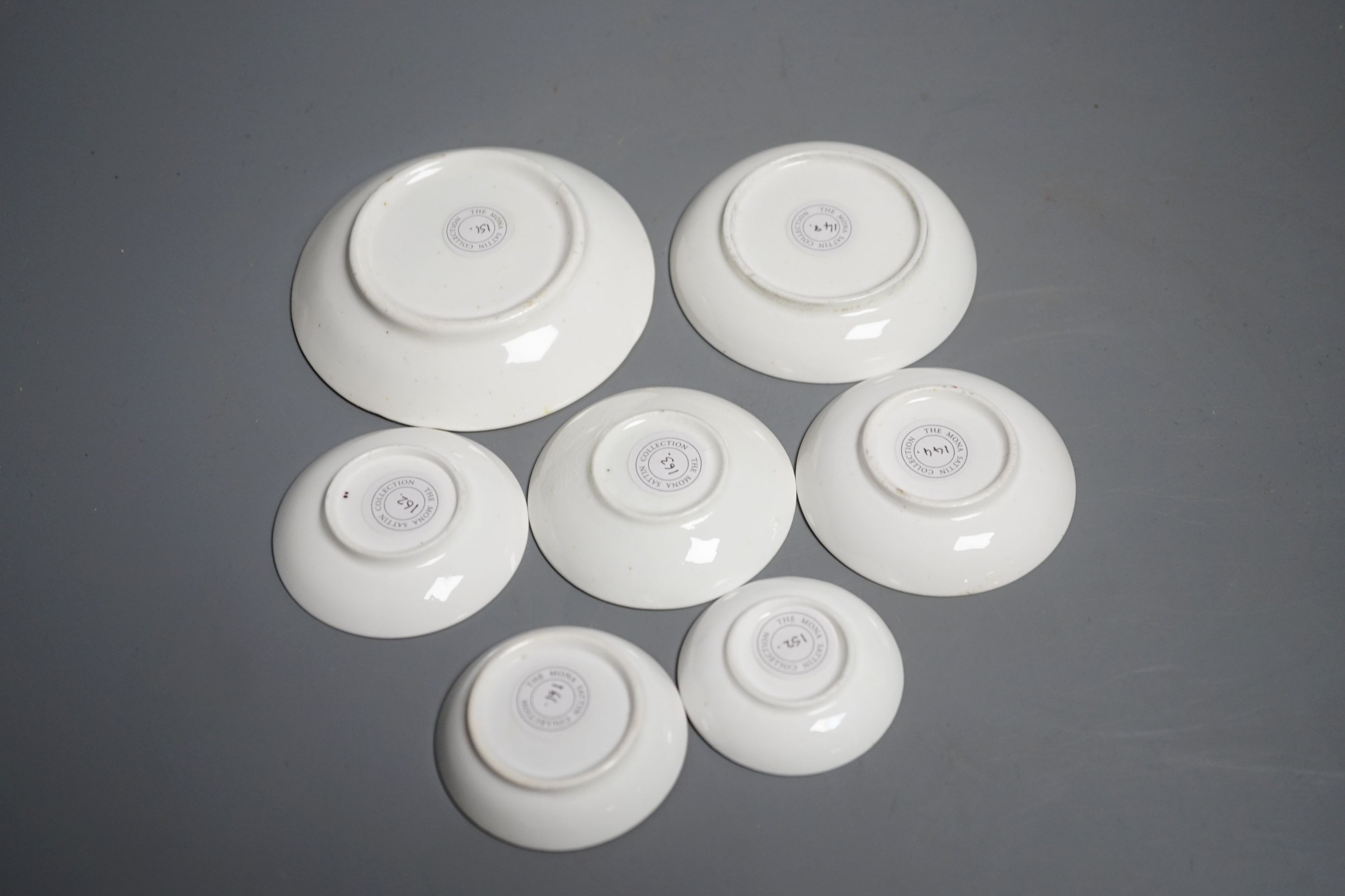 Seven Staffordshire or Alcock miniature teacups and saucers and a similar miniature mug, c.1815-20. Provenance - Mona Sattin collection of miniature cups and saucers, collection no.s 144, 148, 151, 152, 155, 161-163